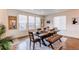 Bright dining room with hardwood floors, bench seating, and large windows, perfect for entertaining at 8107 Arapahoe Peak St, Littleton, CO 80125