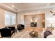 Inviting living room featuring wood floors, modern decor, and a view of the home's entryway at 8107 Arapahoe Peak St, Littleton, CO 80125
