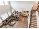 Open floor plan featuring living, dining and kitchen with hardwood floors and comfortable furniture at 8107 Arapahoe Peak St, Littleton, CO 80125