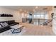 Upstairs loft area features a cozy sitting area with plenty of natural light and neutral carpeting at 8107 Arapahoe Peak St, Littleton, CO 80125
