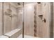 This shower features upgraded tile and a built-in bench at 8107 Arapahoe Peak St, Littleton, CO 80125