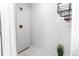 Modern shower with white subway tile, gold fixtures, and a glass door, offering a spa-like experience at 8107 Arapahoe Peak St, Littleton, CO 80125