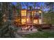 This beautiful home features an outdoor seating area with fire pit, and a large wooden deck at 510 Castle Pines Dr, Castle Rock, CO 80108