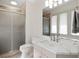 Well-lit bathroom features a glass shower door, marble countertop, and neutral color scheme at 510 Castle Pines Dr, Castle Rock, CO 80108
