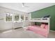 Bright bedroom with a built-in bunk bed, a white dresser, and large windows offering natural light at 510 Castle Pines Dr, Castle Rock, CO 80108