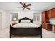 This bedroom features a ceiling fan, natural light from two windows, and built in storage at 510 Castle Pines Dr, Castle Rock, CO 80108