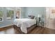 Comfortable bedroom with hardwood floors and bright natural light at 510 Castle Pines Dr, Castle Rock, CO 80108