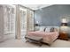 Bright bedroom boasts large windows with shutters, a ceiling fan, and neutral tones for a serene retreat at 510 Castle Pines Dr, Castle Rock, CO 80108