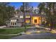 Charming home exterior with manicured lawn, stone accents, and inviting walkway through a wooded area at 510 Castle Pines Dr, Castle Rock, CO 80108