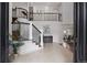 Grand foyer with high ceilings, staircase with iron railings, and an open layout to the dining and living spaces at 510 Castle Pines Dr, Castle Rock, CO 80108