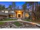 Beautiful home showcasing a landscaped front yard, stone walkway, and a welcoming double-door entrance with stone columns at 510 Castle Pines Dr, Castle Rock, CO 80108
