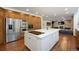 Open kitchen features a large island, stainless steel appliances, and abundant wood cabinetry at 510 Castle Pines Dr, Castle Rock, CO 80108