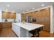 Spacious kitchen with wooden cabinets, stainless steel appliances, and a large island perfect for cooking and entertaining at 510 Castle Pines Dr, Castle Rock, CO 80108