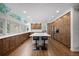 Beautiful kitchen with stainless steel appliances, large center island, custom cabinetry and hardwood floors at 510 Castle Pines Dr, Castle Rock, CO 80108