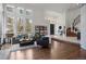 Bright living room with large windows, hardwood floors, fireplace, and open layout, ideal for entertaining at 510 Castle Pines Dr, Castle Rock, CO 80108
