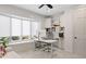 Bright office space with built-in cabinets, a bay window, and an adjustable standing desk at 510 Castle Pines Dr, Castle Rock, CO 80108