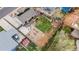 Aerial view of home featuring a spacious backyard with a deck, a patio, and mature trees at 741 Cortez St, Denver, CO 80221