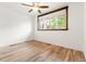 Bright bedroom with hardwood floors, a ceiling fan, and a window letting in natural light at 741 Cortez St, Denver, CO 80221