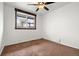 Cozy bedroom featuring natural light from the window and plush carpet at 741 Cortez St, Denver, CO 80221