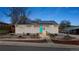 Charming home with solar panels and a vibrant blue front door at 741 Cortez St, Denver, CO 80221