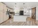The kitchen features white cabinets, granite countertops, and stainless steel appliances at 741 Cortez St, Denver, CO 80221