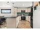 Updated kitchen features sleek appliances, ample cabinets, and stylish backsplash at 741 Cortez St, Denver, CO 80221