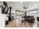 Cozy living room with a wood-burning stove, stylish decor, modern flooring and great natural light at 741 Cortez St, Denver, CO 80221