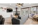 Inviting living room featuring modern flooring, a wood burning stove, and ample natural light at 741 Cortez St, Denver, CO 80221