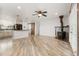 Living Room with a ceiling fan, wood burning stove, and hardwood flooring at 741 Cortez St, Denver, CO 80221