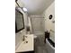 Clean and well-lit bathroom with tile shower, modern vanity, and neutral color scheme at 10702 E Exposition Ave # 101, Aurora, CO 80012