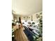 Bright living room with hardwood floors, lots of plants and bright light from windows at 10702 E Exposition Ave # 101, Aurora, CO 80012