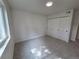 Well-lit bedroom features carpet floors, white walls, and a closet with sliding doors at 14433 E Jewell Ave # 101, Aurora, CO 80012