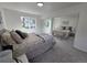 Bedroom with carpet, a large window overlooking the yard, and a mirrored closet for extra storage at 14433 E Jewell Ave # 101, Aurora, CO 80012