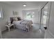 Serene bedroom featuring plush carpeting, a window with natural light, and ample closet space with mirrored doors at 14433 E Jewell Ave # 101, Aurora, CO 80012