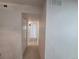 Bright hallway with neutral paint, white doors, and modern flooring, creating a clean and inviting atmosphere at 14433 E Jewell Ave # 101, Aurora, CO 80012