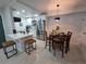 A modern kitchen features an island with seating, stainless steel appliances, and stylish finishes at 14433 E Jewell Ave # 101, Aurora, CO 80012