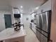 Modern kitchen features stainless steel appliances, sleek countertops, and bright lighting at 14433 E Jewell Ave # 101, Aurora, CO 80012
