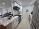 Bright kitchen featuring modern appliances, sleek countertops, and stylish cabinetry at 14433 E Jewell Ave # 101, Aurora, CO 80012