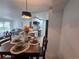 Cozy dining area with views of the modern kitchen and comfortable living room, perfect for Gathering gatherings at 14433 E Jewell Ave # 101, Aurora, CO 80012