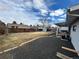 Large backyard featuring a rock area, grass, wooden fence, storage shed and mature tree at 3097 W 134Th Way, Broomfield, CO 80020