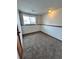 Unfinished basement space with carpeted floors, offering potential for customization at 3097 W 134Th Way, Broomfield, CO 80020