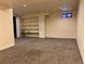 This finished basement includes built-in shelving and a window for natural light at 3097 W 134Th Way, Broomfield, CO 80020