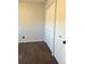 Bedroom featuring soft carpet, a closet with double doors, and ample natural light at 3097 W 134Th Way, Broomfield, CO 80020