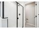 Modern bathroom with glass shower and matte black fixtures at 6265 N Nepal Ct, Aurora, CO 80019