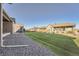 Spacious backyard with manicured lawn, perfect for outdoor activities and relaxation at 8778 S Quatar St, Aurora, CO 80016