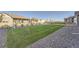Well-maintained backyard with a spacious lawn and minimal shrubs to add privacy at 8778 S Quatar St, Aurora, CO 80016