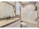 Well-lit bathroom featuring granite countertop, white cabinets, and shower-over-tub combination at 8778 S Quatar St, Aurora, CO 80016