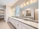 Dual vanity bathroom with ample counter space and neutral finishes at 8778 S Quatar St, Aurora, CO 80016