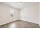 Bright bedroom features neutral walls, window with blinds, and durable floors at 8778 S Quatar St, Aurora, CO 80016