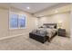 Comfortable bedroom featuring a cozy bed, bench, and modern nightstand at 8778 S Quatar St, Aurora, CO 80016